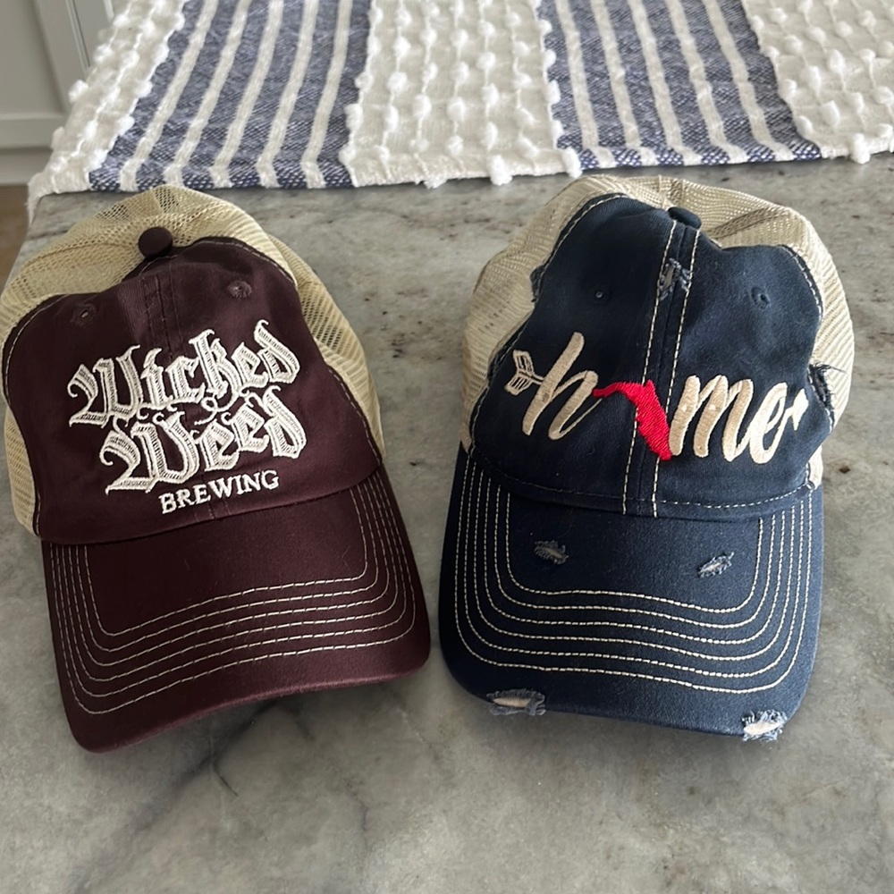 Bundle of two women’s ball caps.